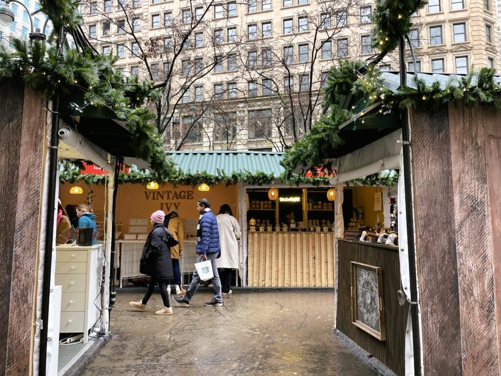 A festive scene from one of New York City's Christmas markets, filled with twinkling lights, handcrafted gifts, and holiday cheer—a must-visit on any Christmas bucket list.
